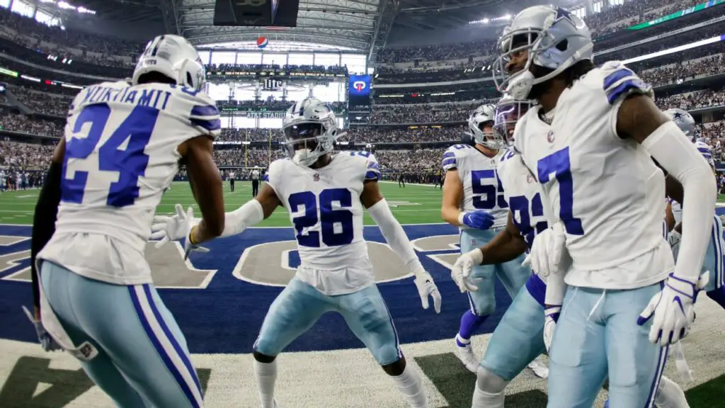 Dallas Cowboys cornerback DaRon Bland (26) celebrates an interception with his teammates. Bland was a fifth-round draft pick by the Cowboys in 2022. AP Photo/Ron Jenkins