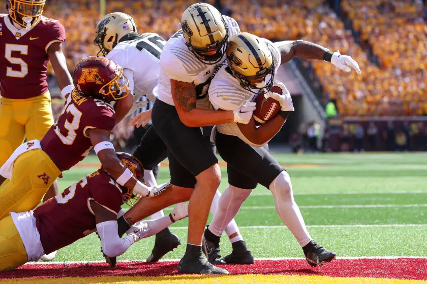 Dylan Downing helps the Boilermakers beat the Gophers 20-10. 