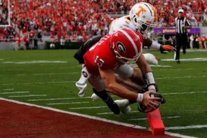 Georgia QB Stetson Bennet dives for the end zone on a 13-yard scramble for the touchdown/All for Tennessee