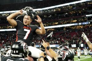 Falcons kicker Younghoe Koo celebrates with teammates after game winning 41-yard FG/The San Diego Union-Tribune