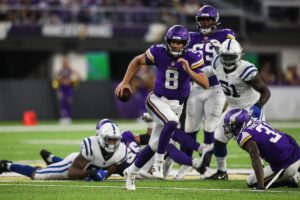 Kirk Cousins runs away from the pressure. Although the Vikings came back from down 33-0 today, the Colts won by protecting its draft stock.