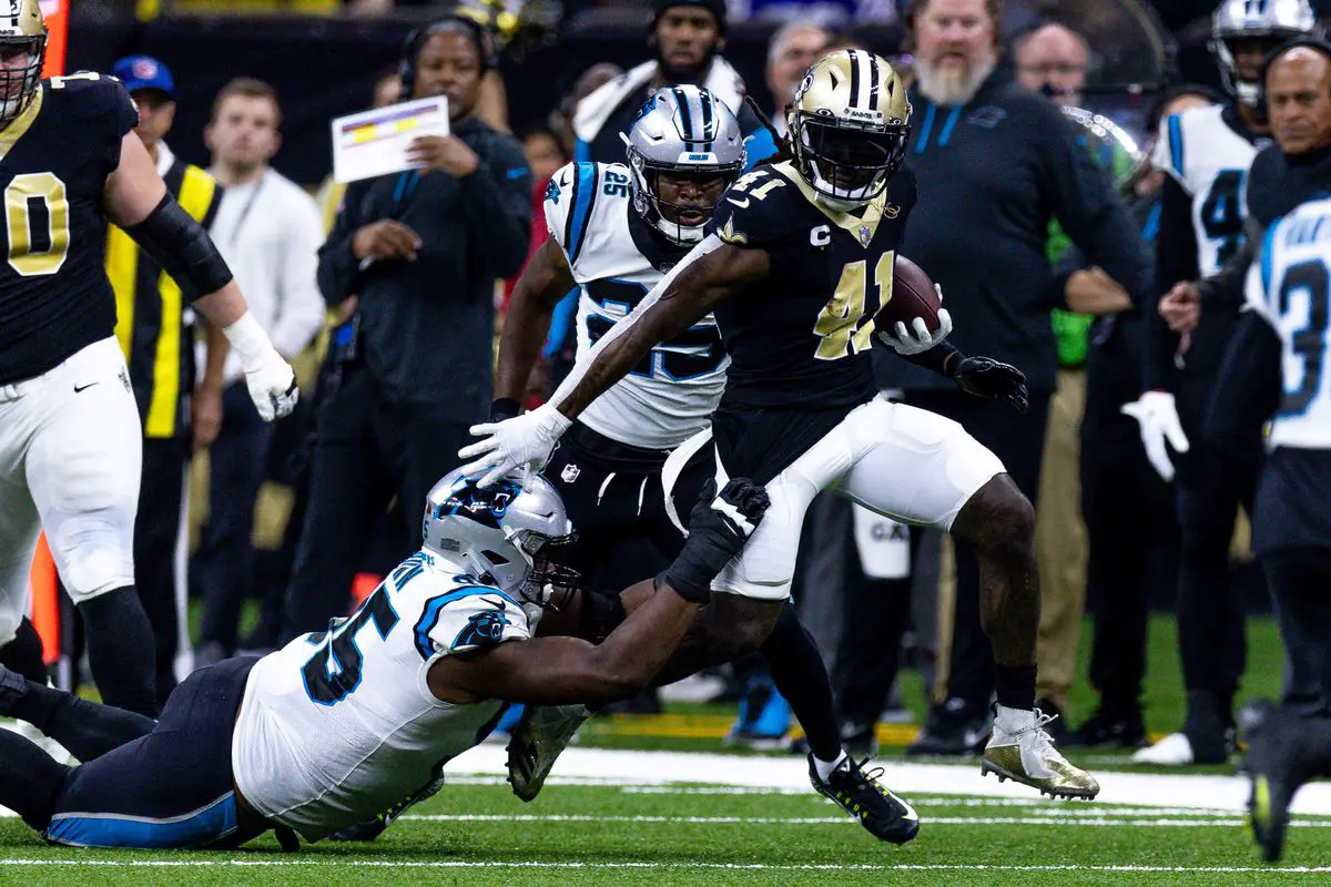 Alvin Kamara breaks loose after a stiff arm on a Panthers defender. Stephen Lew/USA TODAY Sports