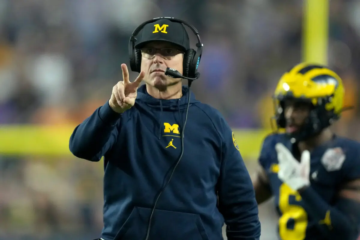 Dec 31, 2022; Glendale, Arizona, USA; Wolverines head coach Jim Harbaugh signals for a two-point conversion after a touchdown against the TCU Horned Frogs in the second half of the 2022 Fiesta Bowl at State Farm Stadium. Mandatory Credit: Kirby Lee-USA TODAY Sports (Las Vegas Raiders)