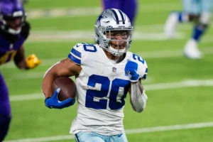 Dallas Cowboys' Tony Pollard runs away from the defense to an open field. Brad Rempel/USA TODAY Sports