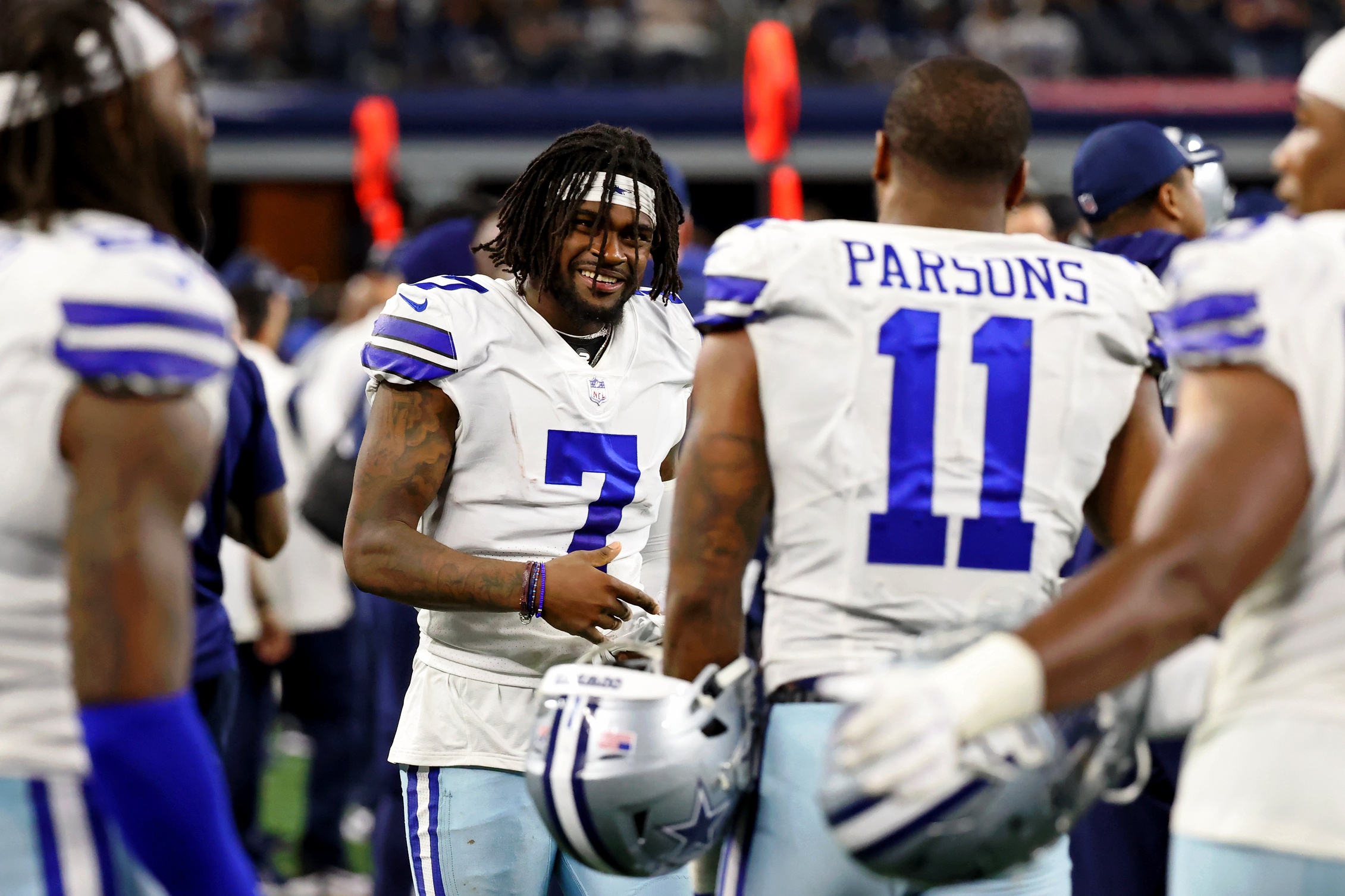 Sep 27, 2021; Arlington, Texas, USA; Dallas Cowboys cornerback Trevon Diggs (7) smiles while talking with linebacker Micah Parsons (11) on the sideline during the fourth quarter of their game against the Philadelphia Eagles at AT&amp;T Stadium. Mandatory Credit: Kevin Jairaj-USA TODAY Sports