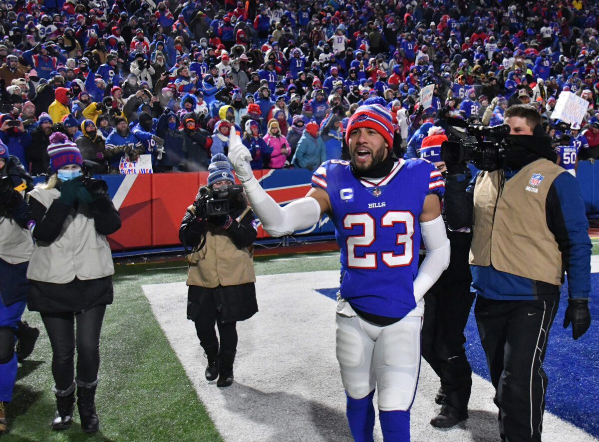 Jan 15, 2022; Orchard Park, New York, USA; Buffalo Bills safety Micah Hyde (23) celebrates after the Bills defeated the New England Patriots 47-17 in the AFC Wild Card playoff game at Highmark Stadium. Mandatory Credit: Mark Konezny-USA TODAY Sports (Aaron Rodgers)