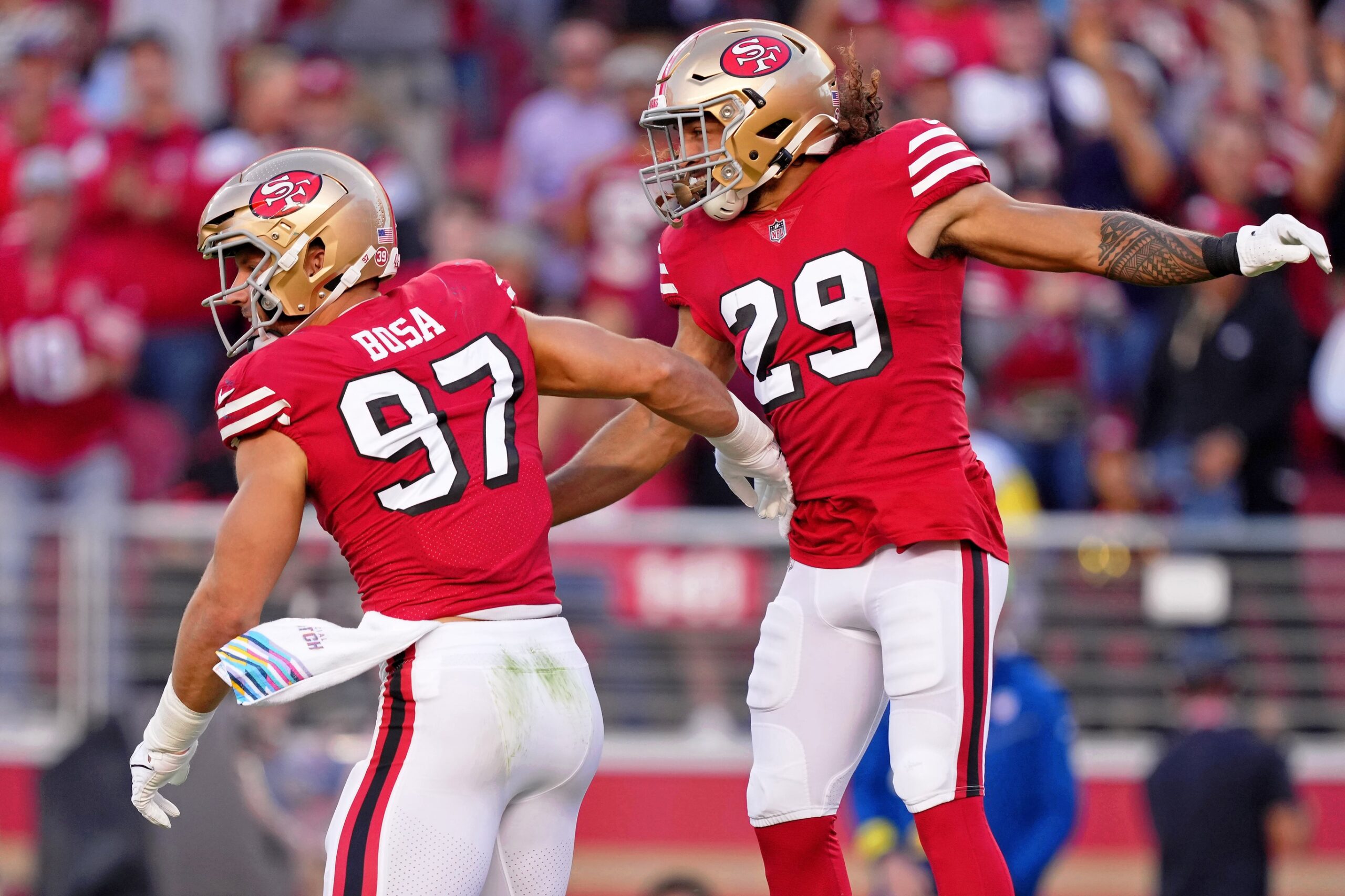 Oct 3, 2022; Santa Clara, California, USA; San Francisco 49ers defensive end Nick Bosa (97) celebrates with safety Talanoa Hufanga (29) after making a sack against the Los Angeles Rams during the first quarter at Levi's Stadium. Mandatory Credit: Kyle Terada-USA TODAY Sports