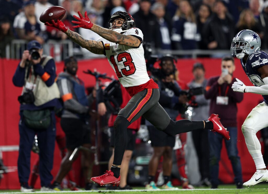 Jan 16, 2023; Tampa, Florida, USA; Tampa Bay Buccaneers wide receiver Mike Evans (13) attempts to make a catch against the Dallas Cowboys during a wild card game at Raymond James Stadium. Mandatory Credit: Nathan Ray Seebeck-USA TODAY Sports