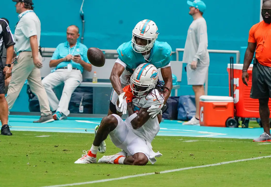 Miami Dolphins cornerback Eli Apple (33) and wide receiver Daewood Davis (87) participate during the scrimmage at Hard Rock Stadium, Saturday, August 5, 2023 in Miami Gardens.