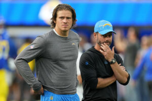 Aug 12, 2023; Inglewood, California, USA; Los Angeles Chargers quarterback Justin Herbert (10) and coach Brandon Staley react during the game against the Los Angeles Rams at SoFi Stadium. Mandatory Credit: Kirby Lee-USA TODAY Sports