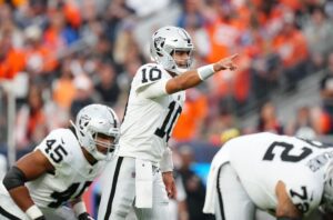 Jimmy Garoppolo Sep 10, 2023; Denver, Colorado, USA; Las Vegas Raiders quarterback Jimmy Garoppolo (10) calls out in the third quarter against the Denver Broncos at Empower Field at Mile High. Mandatory Credit: Ron Chenoy-USA TODAY Sports