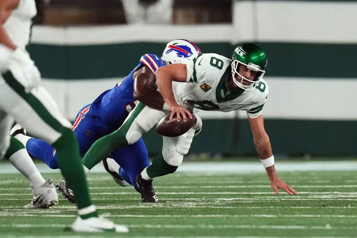 Buffalo Bills defensive end Leonard Floyd (56) sacks New York Jets quarterback Aaron Rodgers (8) early in the first quarter during the home opener at MetLife Stadium on Monday, Sept. 11, 2023, in East Rutherford. Rodgers was carted off the field after being hit. © Danielle Parhizkaran/NorthJersey.com / USA TODAY NETWORK