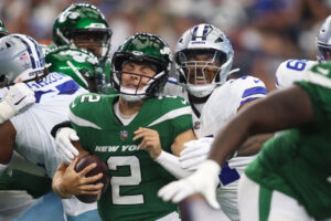 Sep 17, 2023; Arlington, Texas, USA; New York Jets quarterback Zach Wilson (2) is sacked by Dallas Cowboys linebacker Micah Parsons (11) in the first quarter at AT&T Stadium. Mandatory Credit: Tim Heitman-USA TODAY Sports