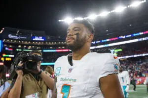 Sep 17, 2023; Foxborough, Massachusetts, USA; Miami Dolphins quarterback Tua Tagovailoa (1) reacts after defeating the New England Patriots at Gillette Stadium. Mandatory Credit: Paul Rutherford-USA TODAY Sports
