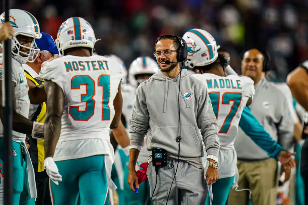 Sep 17, 2023; Foxborough, Massachusetts, USA; Miami Dolphins head coach Mike McDaniel reacts after a touchdown run by running back Raheem Mostert (31) against the New England Patriots at Gillette Stadium. Mandatory Credit: David Butler II-USA TODAY Sports