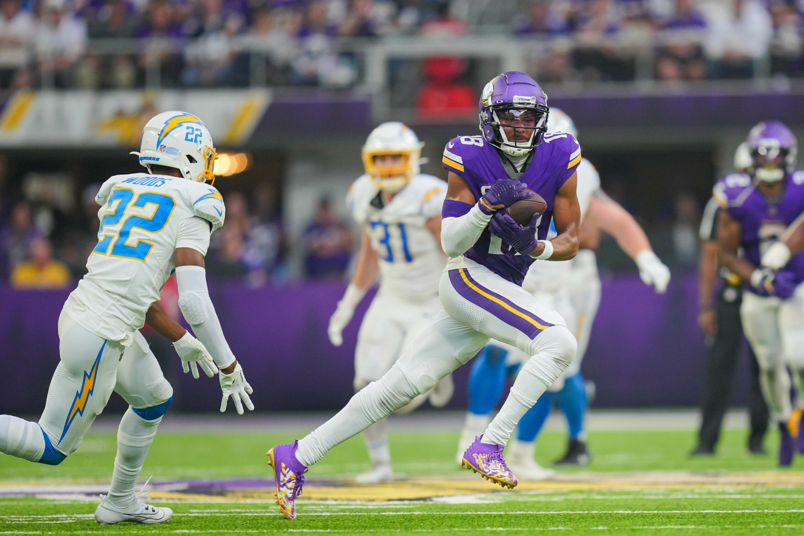 Sep 24, 2023; Minneapolis, Minnesota, USA; Minnesota Vikings wide receiver Justin Jefferson (18) runs after the catch against the Los Angeles Chargers in the fourth quarter at U.S. Bank Stadium. Mandatory Credit: Brad Rempel-USA TODAY Sports
