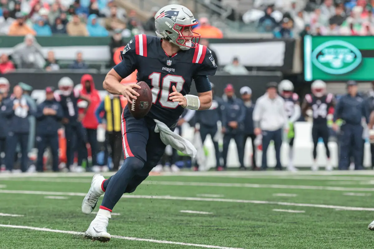 Bill Belichick Sep 24, 2023; East Rutherford, New Jersey, USA; New England Patriots quarterback Mac Jones (10) rolls out during the first half against the New York Jets at MetLife Stadium. Mandatory Credit: Vincent Carchietta-USA TODAY Sports