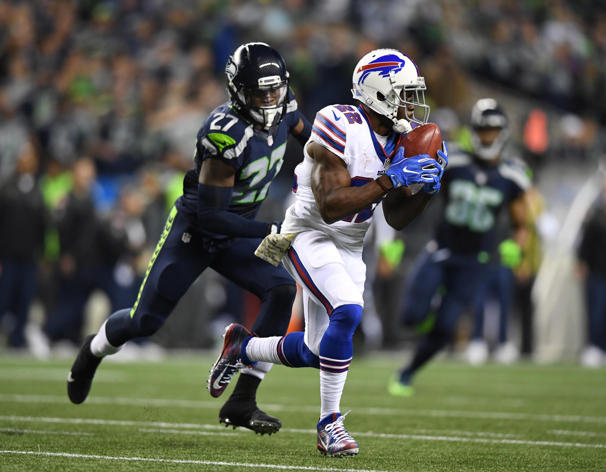 Nov 7, 2016; Seattle, WA, USA; Buffalo Bills running back Reggie Bush (22) is pursued by Seattle Seahawks cornerback Neiko Thorpe (27) on a punt return during a NFL football game at CenturyLink Field. The Seahawks defeated the Bills 31-25. Mandatory Credit: Kirby Lee-USA TODAY Sports