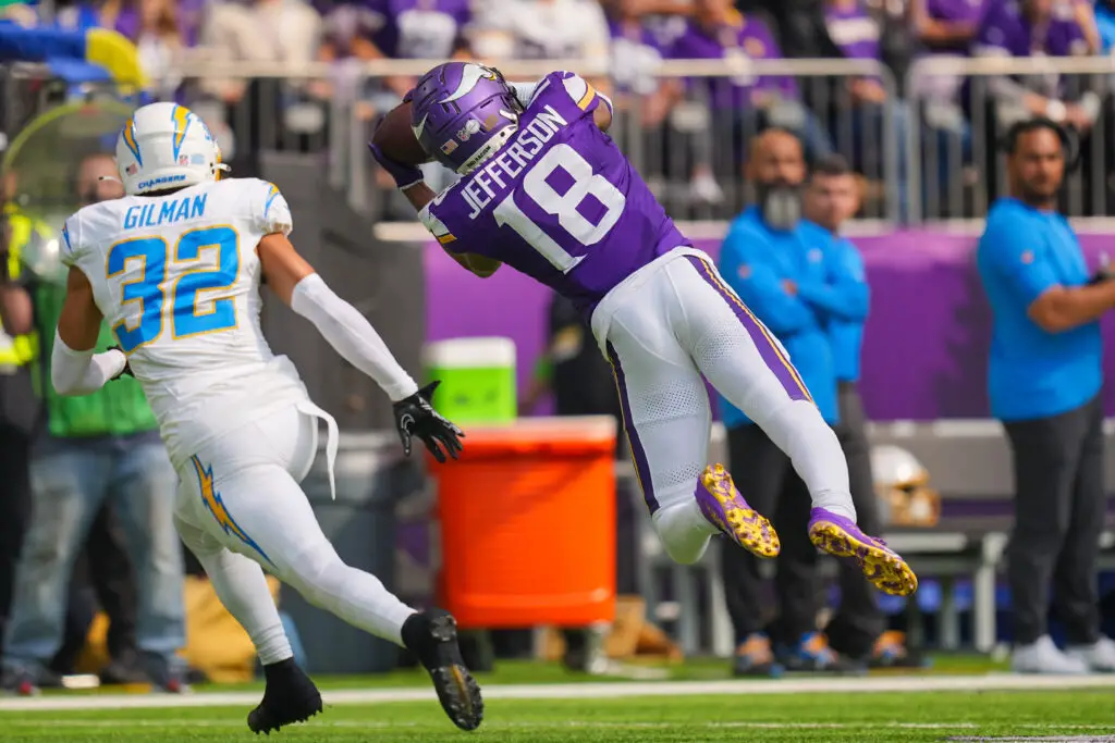 Sep 24, 2023; Minneapolis, Minnesota, USA; Minnesota Vikings wide receiver Justin Jefferson (18) catches a pass against the Los Angeles Chargers in the second quarter at U.S. Bank Stadium. Mandatory Credit: Brad Rempel-USA TODAY Sports