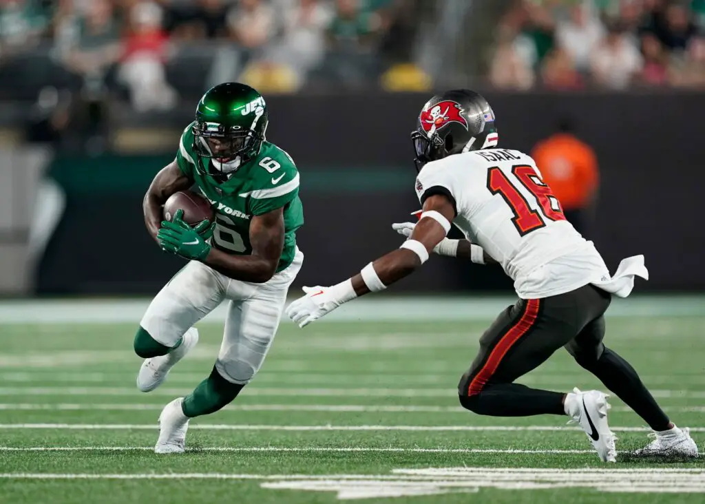 New York Jets wide receiver Mecole Hardman Jr. (6) runs with the ball with pressure from Tampa Bay Buccaneers cornerback Keenan Isaac (16) in the first half of a preseason NFL game at MetLife Stadium on Saturday, Aug. 19, 2023, in East Rutherford. (Green Bay Packers Aaron Rodgers)
