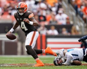 Cleveland Browns quarterback Deshaun Watson (4) escapes from Tennessee Titans safety <a rel=