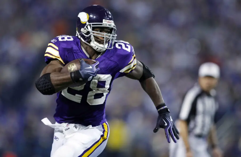 Nov 29, 2009; Minneapolis, MN, USA; Minnesota Vikings Adrian Peterson (28) rushes against the Chicago Bears in the third quarter at the Metrodome. Mandatory credit: Bruce Kluckhohn USA TODAY Sports