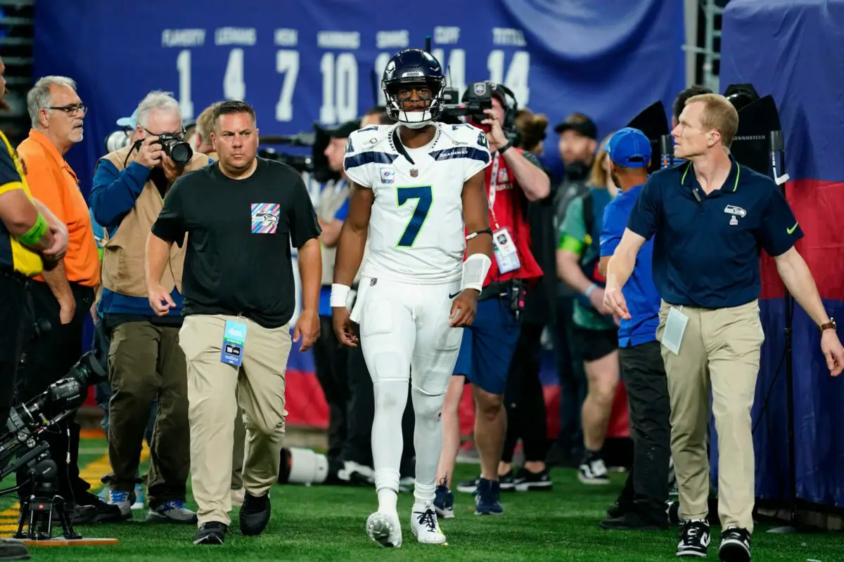 Seattle Seahawks Geno Smith goes to the locker room after a hit by Isaiah Simmons