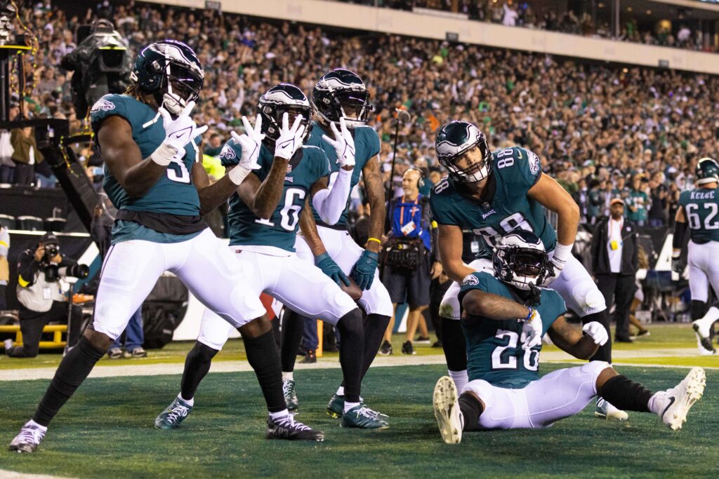 Oct 16, 2022; Philadelphia, Pennsylvania, USA; Philadelphia Eagles wide receiver DeVonta Smith (6) celebrates with tight end Dallas Goedert (88) and running back Miles Sanders (26) and wide receiver Quez Watkins (16) after his touchdown catch against the Dallas Cowboys during the fourth quarter at Lincoln Financial Field. Mandatory Credit: Bill Streicher-USA TODAY Sports