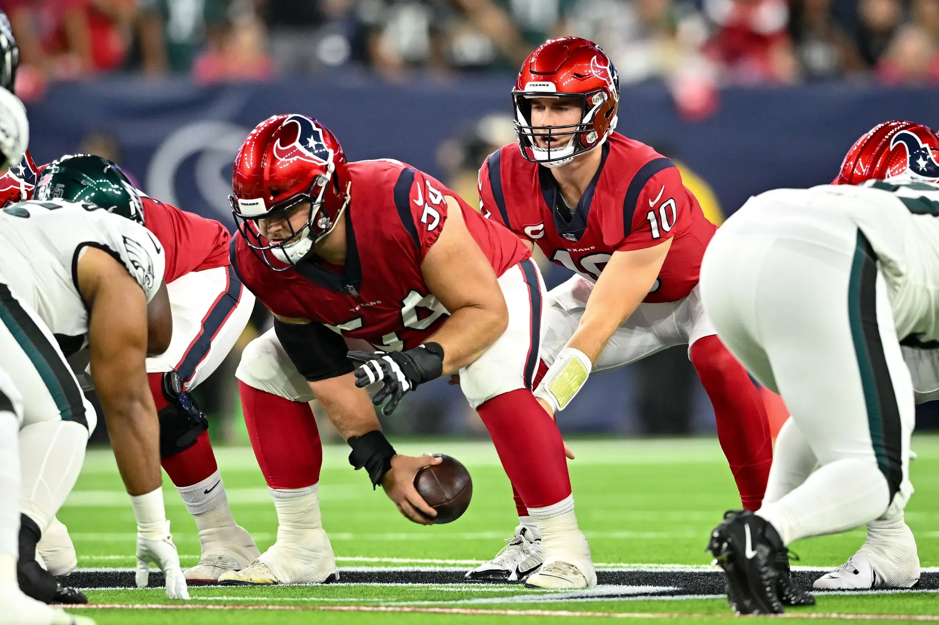 Nov 3, 2022; Houston, Texas, USA;  Houston Texans quarterback Davis Mills (10) receives the snap from center Scott Quessenberry (54) during the first quarter against the Philadelphia Eagles at NRG Stadium. Mandatory Credit: Maria Lysaker-USA TODAY Sports