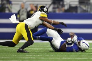 Nov 28, 2022; Indianapolis, Indiana, USA; Indianapolis Colts tight end Jelani Woods (80) falls after a catch ahead of Pittsburgh Steelers inside linebacker Myles Jack (51) during the second half at Lucas Oil Stadium. Mandatory Credit: Trevor Ruszkowski-USA TODAY Sports