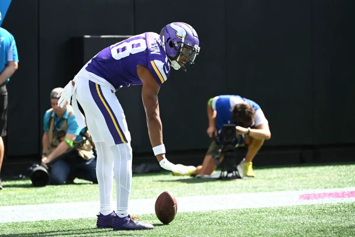 Oct 1, 2023; Charlotte, North Carolina, USA; Minnesota Vikings wide receiver Justin Jefferson (18) reacts after scoring a touchdown in the third quarter at Bank of America Stadium. Mandatory Credit: Bob Donnan-USA TODAY Sports