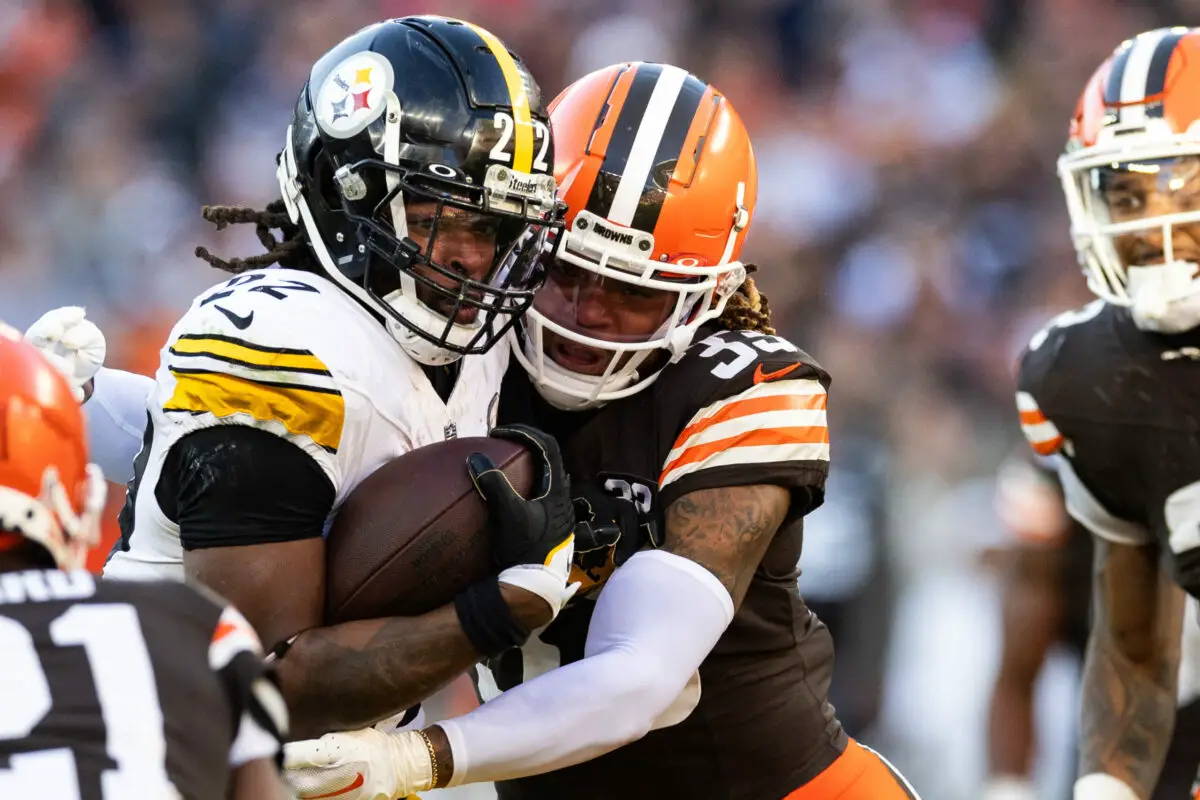 Nov 19, 2023; Cleveland, Ohio, USA; Cleveland Browns safety Ronnie Hickman (33) tackles Pittsburgh Steelers running back Najee Harris (22) during the fourth quarter at Cleveland Browns Stadium. Mandatory Credit: Scott Galvin-USA TODAY Sports