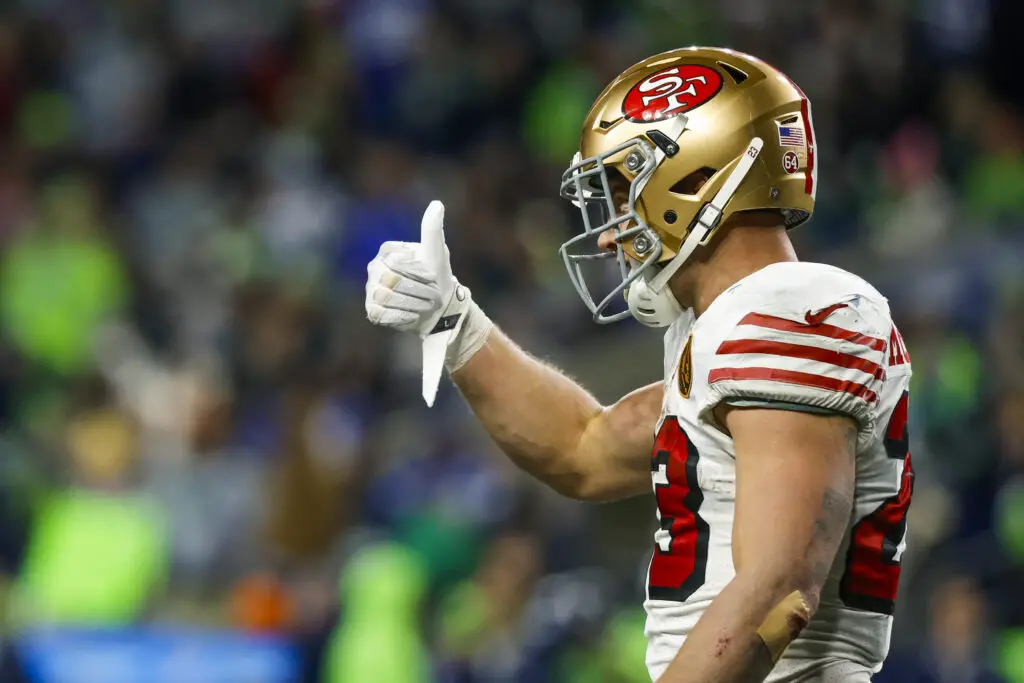 Nov 23, 2023; Seattle, Washington, USA; San Francisco 49ers running back Christian McCaffrey (23) reacts after rushing for a touchdown against the Seattle Seahawks during the second quarter at Lumen Field. Mandatory Credit: Joe Nicholson-USA TODAY Sports