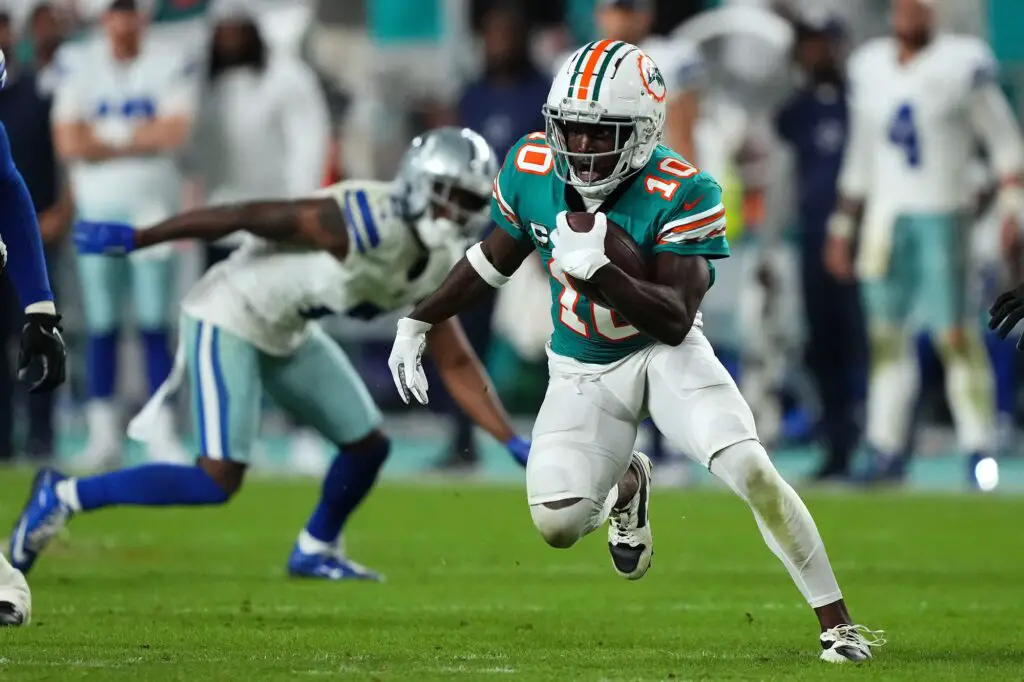 Dec 24, 2023; Miami Gardens, Florida, USA; Miami Dolphins wide receiver Tyreek Hill (10) runs with the ball after a catch during the second half against the Dallas Cowboys at Hard Rock Stadium. Mandatory Credit: Jasen Vinlove-USA TODAY Sports