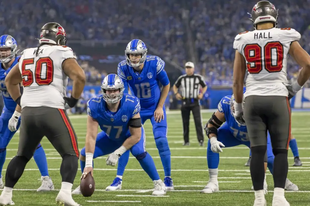Detroit Lions' Offensive Coordinator's Strong Six-Word Message on Replacing Ben Johnson 2 Jan 21, 2024; Detroit, Michigan, USA; Detroit Lions center Frank Ragnow (77) prepares to snap the ball to quarterback Jared Goff (16) against the Tampa Bay Buccaneers during the first half in a 2024 NFC divisional round game at Ford Field. Mandatory Credit: David Reginek-USA TODAY Sports