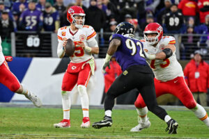 Jan 28, 2024; Baltimore, Maryland, USA; Kansas City Chiefs quarterback Patrick Mahomes (15) looks to pass the ball against the Baltimore Ravens during the second half in the AFC Championship football game at M&T Bank Stadium. Mandatory Credit: Tommy Gilligan-USA TODAY Sports