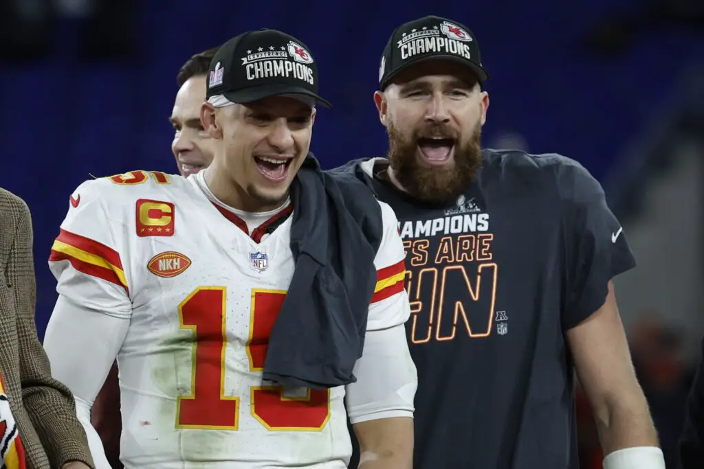 Jan 28, 2024; Baltimore, Maryland, USA; Kansas City Chiefs quarterback Patrick Mahomes (15) and Chiefs tight end Travis Kelce (R) celebrate on the stage prior to the trophy presentation after their' game against the Baltimore Ravens in the AFC Championship football game at M&T Bank Stadium. Mandatory Credit: Geoff Burke-USA TODAY Sports