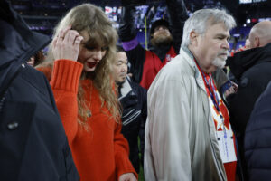 Jan 28, 2024; Baltimore, Maryland, USA; Singer/songwriter Taylor Swift walks off the field after the trophy presentation the Kansas City Chiefs after their game against the Baltimore Ravens in the AFC Championship football game at M&T Bank Stadium. Mandatory Credit: Geoff Burke-USA TODAY Sports