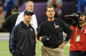John and Jim Harbaugh in an on field discussion.