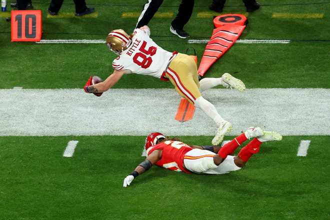 George Kittle #85 of the San Francisco 49ers dives for a first down in the fourth quarter against the Kansas City Chiefs during Super Bowl LVIII at Allegiant Stadium on February 11, 2024 in Las Vegas, Nevada. Credit: Michael Reeves/Getty Images