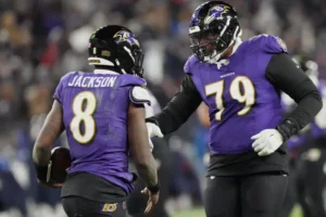 Jan 20, 2024; Baltimore, MD, USA; Baltimore Ravens quarterback Lamar Jackson (8) celebrates with offensive tackle Ronnie Stanley (79) after scoring a touchdown against the Houston Texans during the third quarter of a 2024 AFC divisional round game at M&T Bank Stadium.Mitch Stringer-USA TODAY Sports