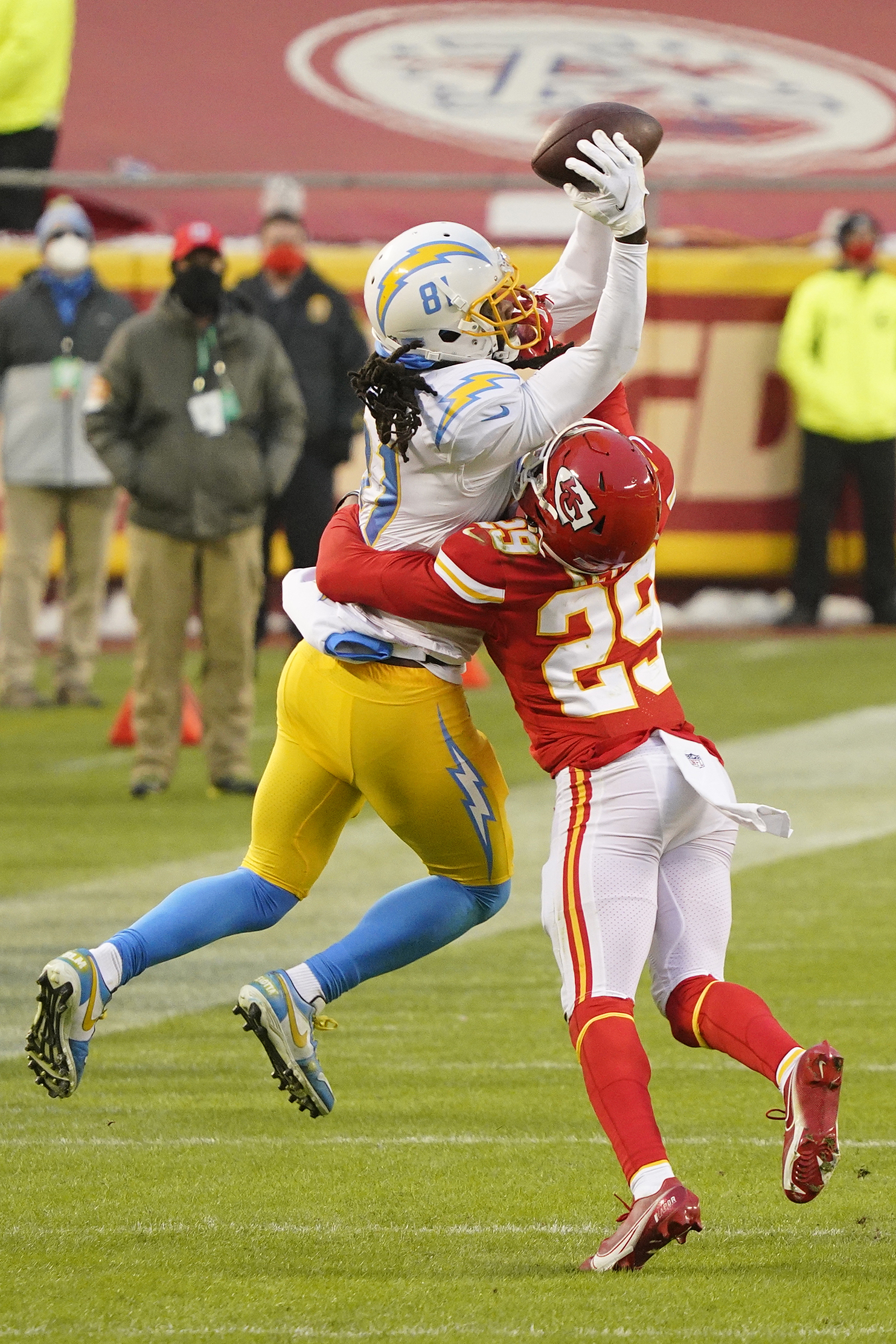 Jan 3, 2021; Kansas City, Missouri, USA; Los Angeles Chargers wide receiver Mike Williams (81) catches a pass against Kansas City Chiefs cornerback BoPete Keyes (29) during the first half at Arrowhead Stadium. Mandatory Credit: Jay Biggerstaff-USA TODAY Sports