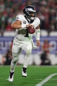 Jan 15, 2024; Tampa, Florida, USA; Philadelphia Eagles quarterback Jalen Hurts (1) runs the ball against the Tampa Bay Buccaneers during the second half of a 2024 NFC wild card game at Raymond James Stadium. Mandatory Credit: Nathan Ray Seebeck-USA TODAY Sports