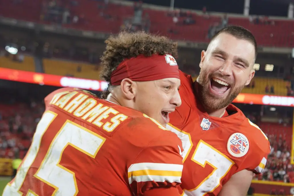 Oct 10, 2022; Kansas City, Missouri, USA; Kansas City Chiefs quarterback Patrick Mahomes (15) interrupts tight end Travis Kelce (87) while talking with a report after the game against the Las Vegas Raiders at GEHA Field at Arrowhead Stadium. Mandatory Credit: ​Denny Medley-USA TODAY Sports