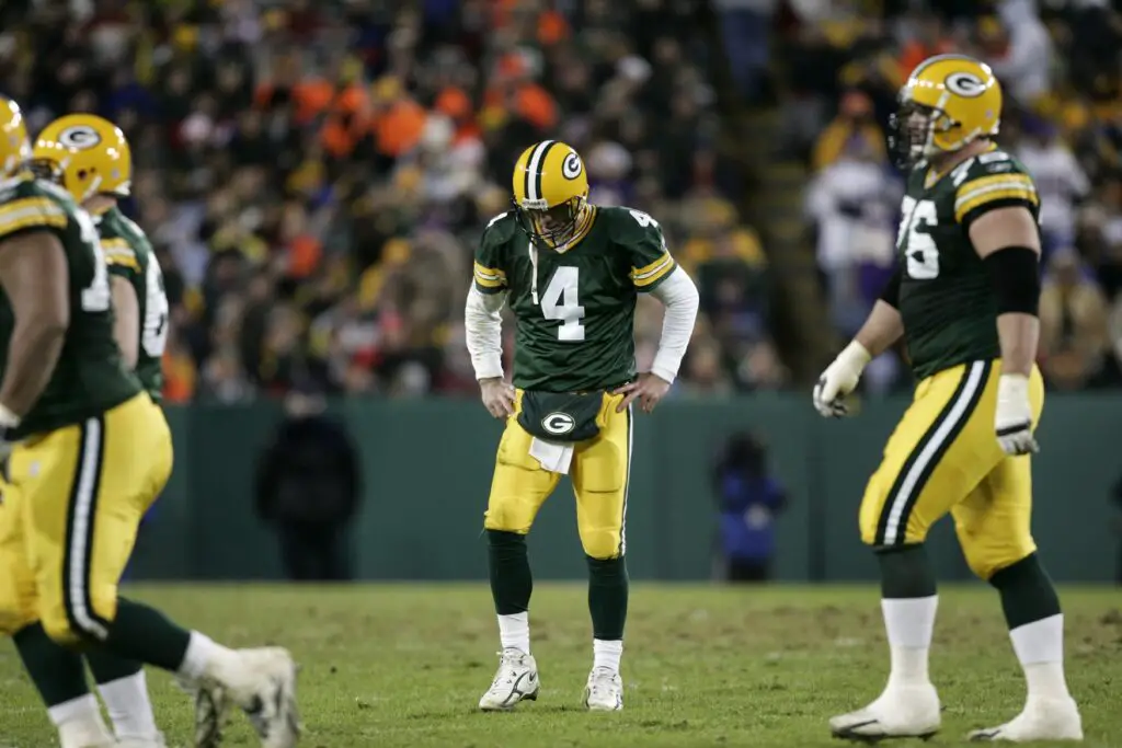 November 21, 2005; Green Bay, WI, USA; Green Bay Packers quarterback #4 Brett Favre hangs his head as Green Bay Packers tackle #75 Chad Clifton walks off the field after throwing an interception during during the third quarter against Minnesota Vikings at Lambeau Field. Mandatory Credit: Photo By Jeff Hanisch-USA TODAY Sports Copyright (c) 2005 Jeff Hanisch