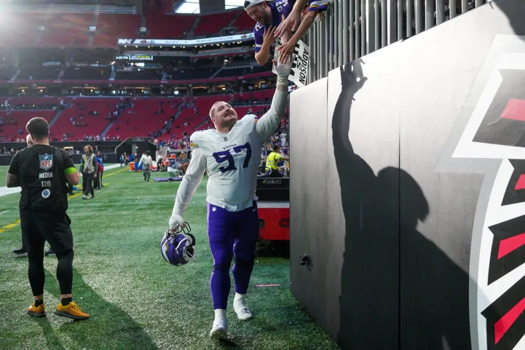 Nov 5, 2023; Atlanta, Georgia, USA; Minnesota Vikings defensive tackle Harrison Phillips (97) celebrates with fans after a victory against the Atlanta Falcons at Mercedes-Benz Stadium. Mandatory Credit: Brett Davis-USA TODAY Sports