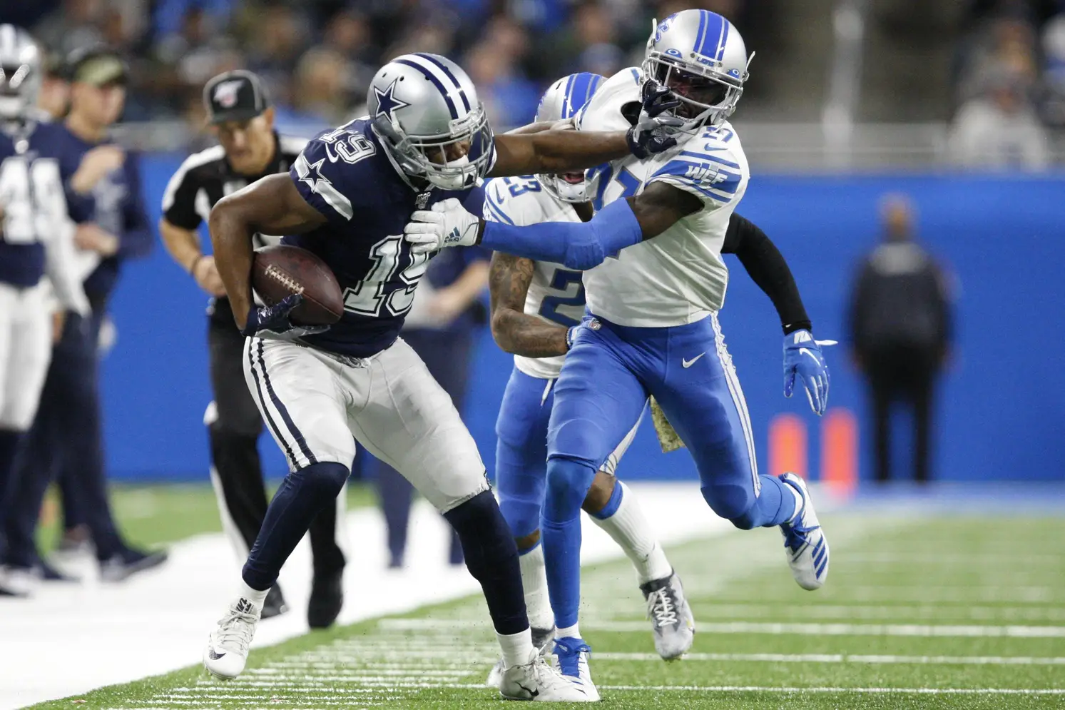 Nov 17, 2019; Detroit, MI, USA; Dallas Cowboys wide receiver Amari Cooper (19) stiff arms Detroit Lions cornerback Justin Coleman (27) after a catch during the fourth quarter at Ford Field. Mandatory Credit: Raj Mehta-USA TODAY Sports