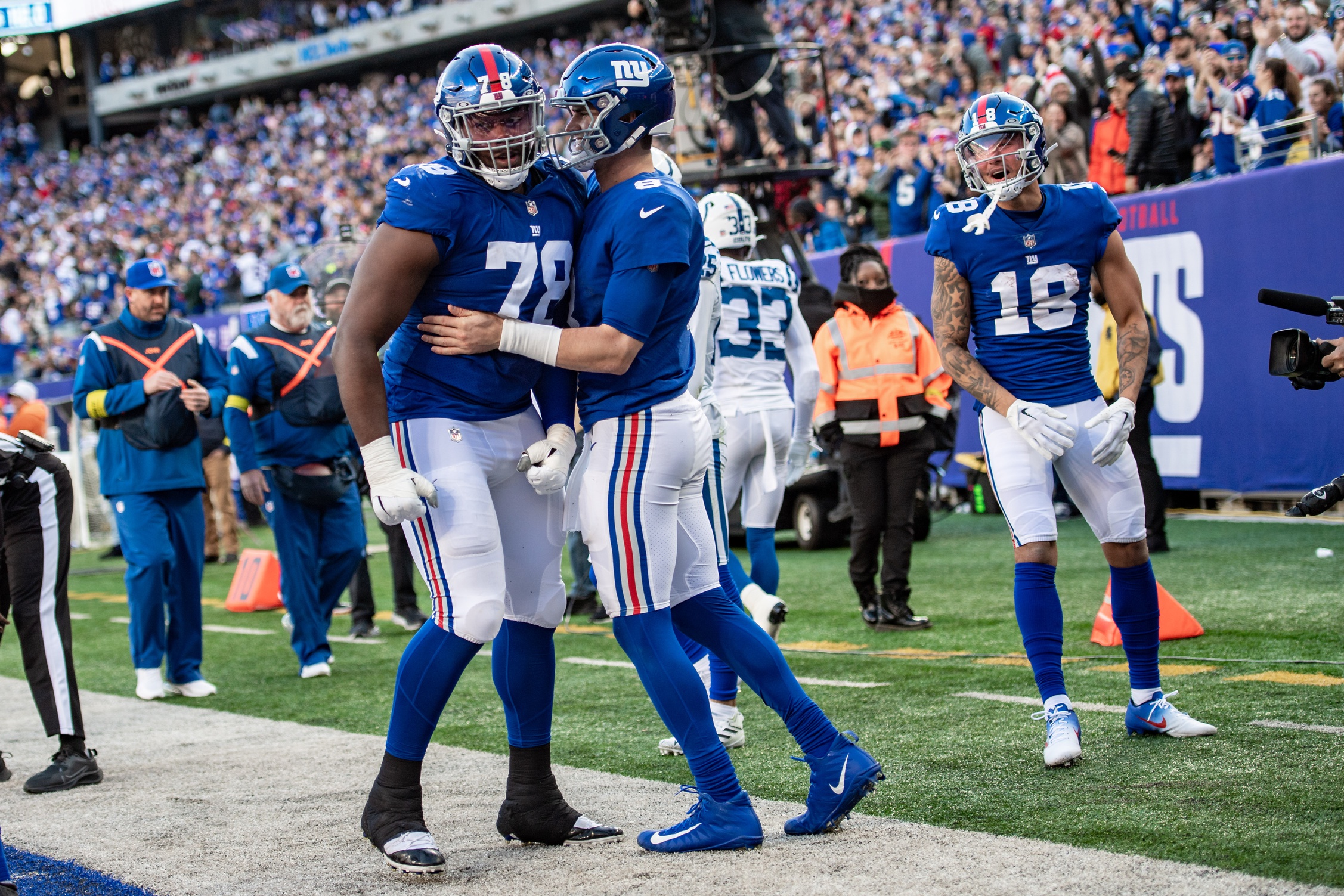 Jan 1, 2023; East Rutherford, New Jersey, USA; New York Giants quarterback Daniel Jones (8) celebrates with New York Giants offensive tackle Andrew Thomas (78) after rushing for a touchdown against the Indianapolis Colts during the second half at MetLife Stadium. Mandatory Credit: John Jones-USA TODAY Sports