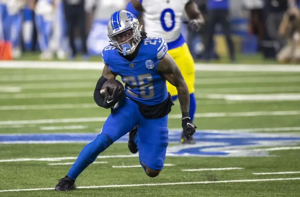 Jan 14, 2024; Detroit, Michigan, USA; Detroit Lions running back Jahmyr Gibbs (26) runs during the first half of a 2024 NFC wild card game against the Los Angeles Rams at Ford Field. Mandatory Credit: David Reginek-USA TODAY Sports