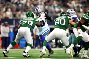 Sep 17, 2023; Arlington, Texas, USA; Dallas Cowboys defensive tackle Mazi Smith (58) rushes the passer while blocked by New York Jets guard Laken Tomlinson (78) in the third quarter at AT&T Stadium. Mandatory Credit: Tim Heitman-USA TODAY Sports